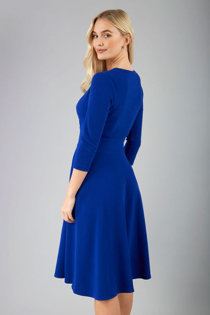 blonde model is wearing diva catwalk january sleeved a-line v-neck dress in royal blue front