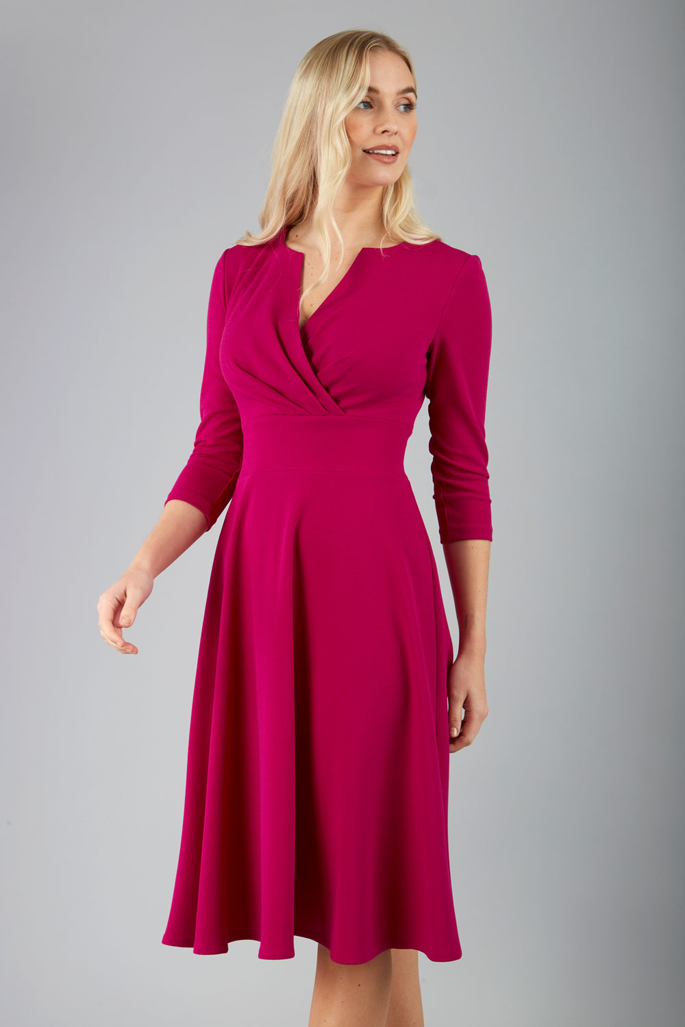 blonde model is wearing diva catwalk january sleeved a-line v-neck dress in magenta front