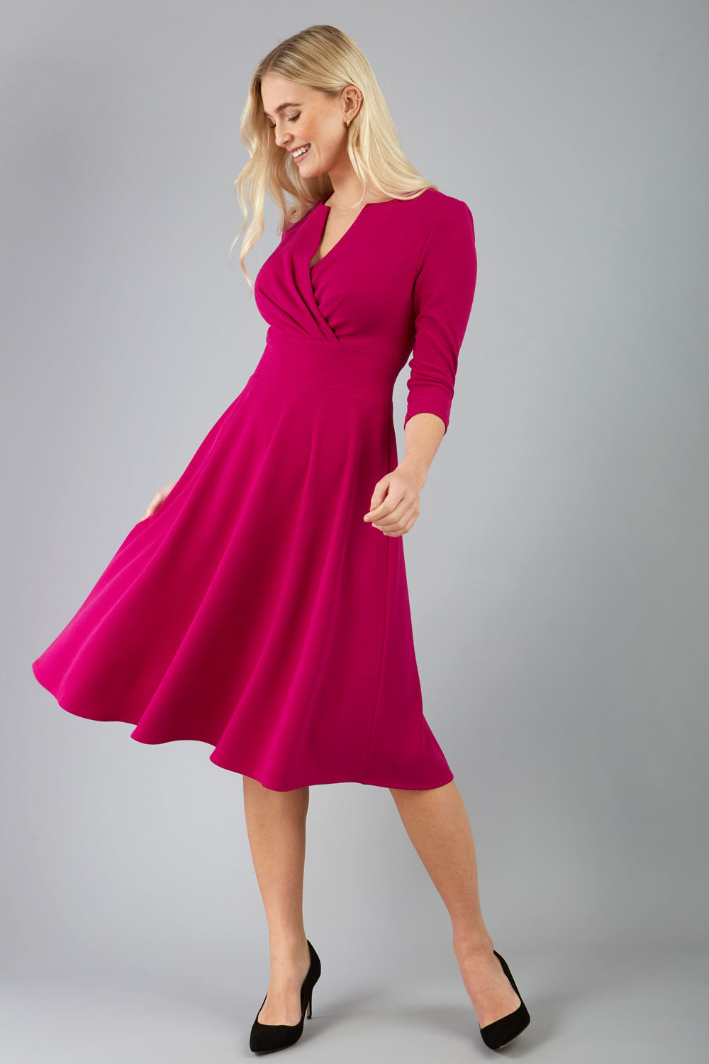 blonde model is wearing diva catwalk january sleeved a-line v-neck dress in magenta front