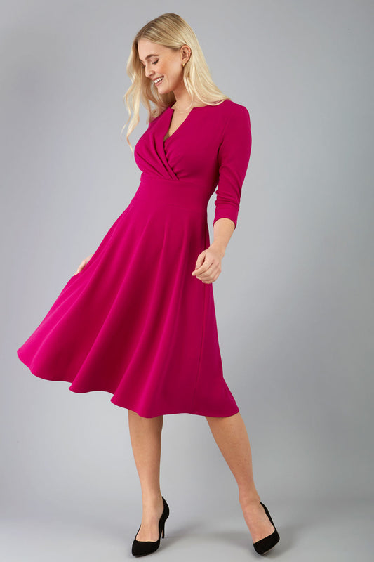 blonde model is wearing diva catwalk january sleeved a-line v-neck dress in magenta front