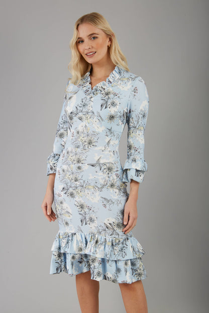 model is wearing diva catwalk fern printed dress with rushes and sleeves in light blue front