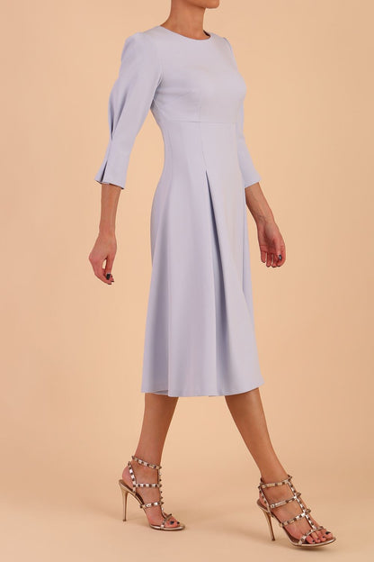 model is wearing diva catwalk harpsden a-line skirt 3/4 sleeve swing dress with rounded neckline in Celestial Blue front side