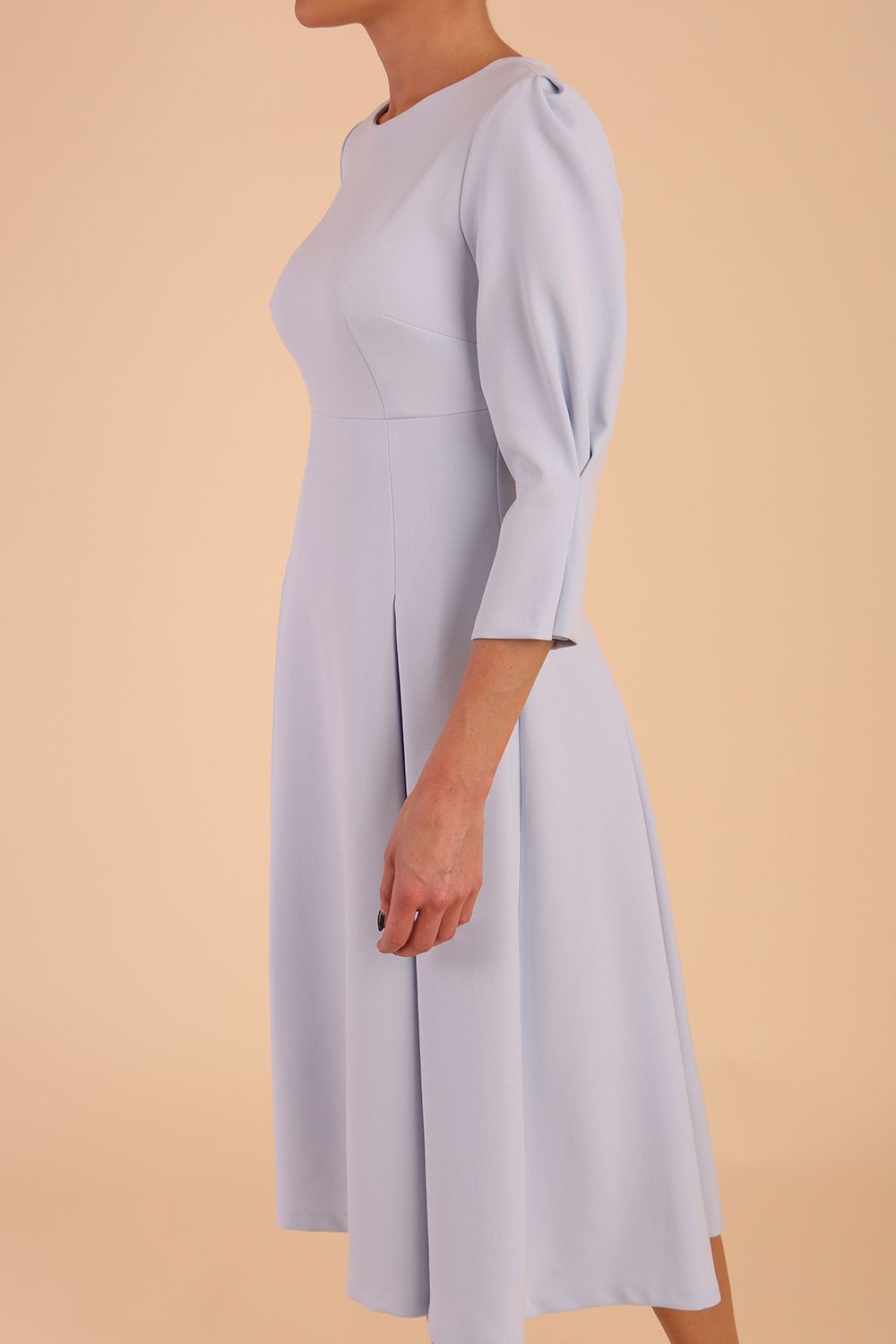 model is wearing diva catwalk harpsden a-line skirt 3/4 sleeve swing dress with rounded neckline in Celestial Blue front side