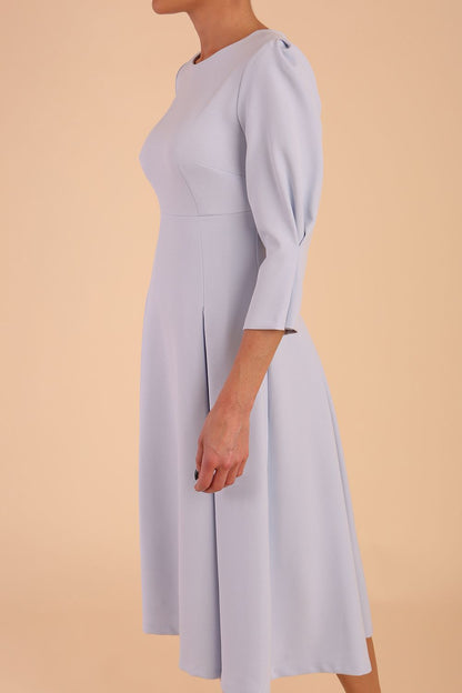 model is wearing diva catwalk harpsden a-line skirt 3/4 sleeve swing dress with rounded neckline in Celestial Blue front side