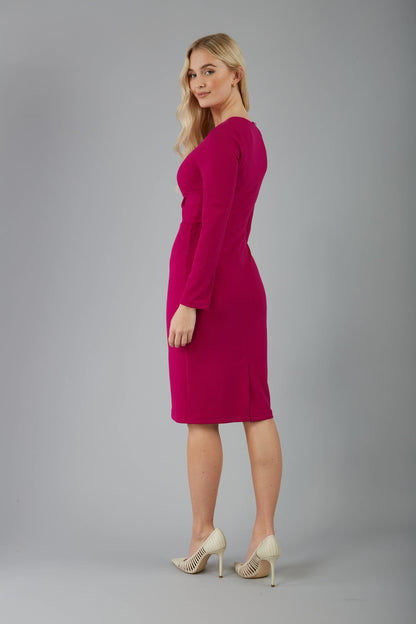 blonde model is wearing diva catwalk gately pencil dress with long sleeves and twisted low v-neck in magenta front