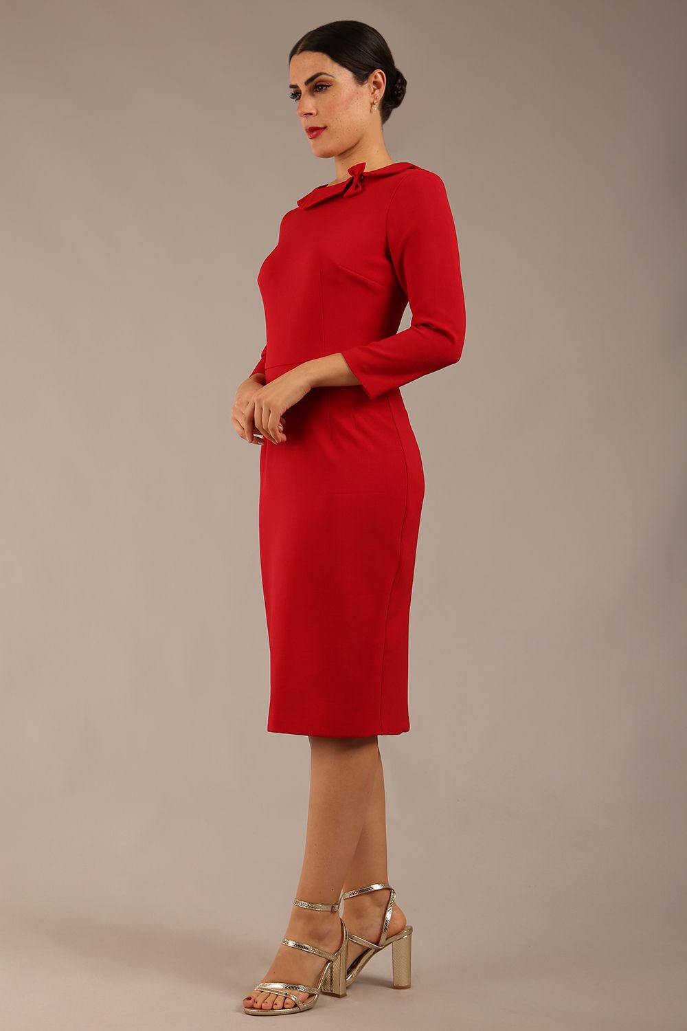 brunette model is wearing a diva catwalk  Helium 3/4 Sleeved Pencil Dress with 3/4 sleeve and knee length and bow detail on the neckline in dark red colour front close up