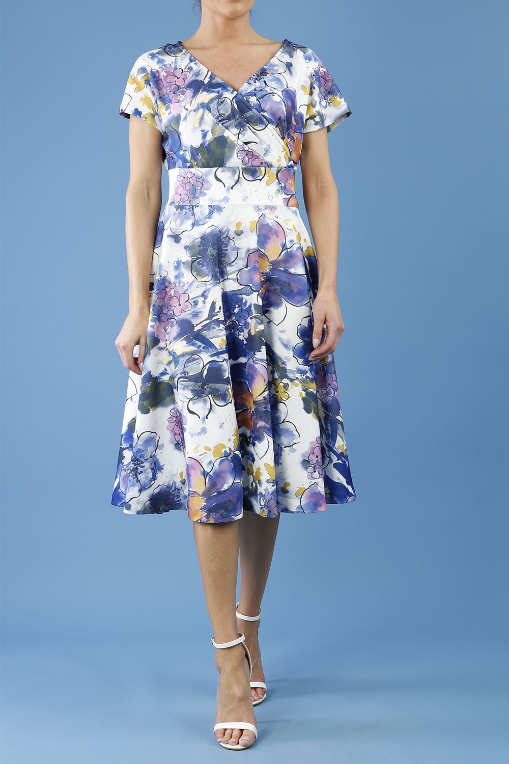 blonde model is wearing diva catwalk boston short sleeve v-neckline a-line swing dress in abstract hibiscus print back