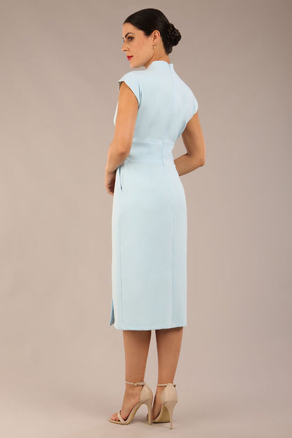 brunette Model is wearing a diva catwalk Derby pencil skirt dress cap sleeves with buttons details at the waistband and star neckline below the knee length with pockets in sky blue colour front image with sunglasses