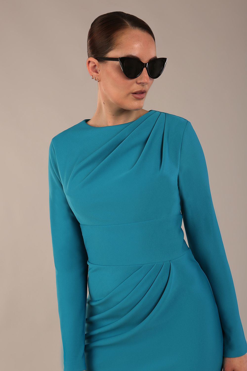 model wearing a diva catwalk Olgivy Long Sleeve Knee Length Pencil Dress round neckline and long sleeve in magic blue colour front