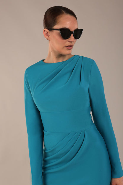 model wearing a diva catwalk Olgivy Long Sleeve Knee Length Pencil Dress round neckline and long sleeve in magic blue colour front