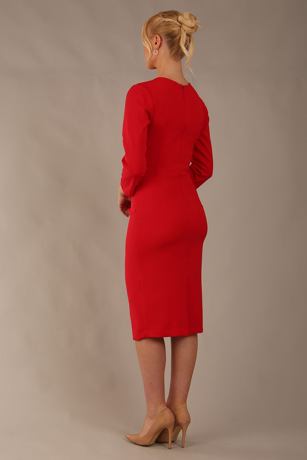 model is wearing diva catwalk miracle pencil dress with keyhole detail on a side of the front panel and gathering detail on a side or bodice panel with sleeves in scarlet red colour front (Scarlet Red)