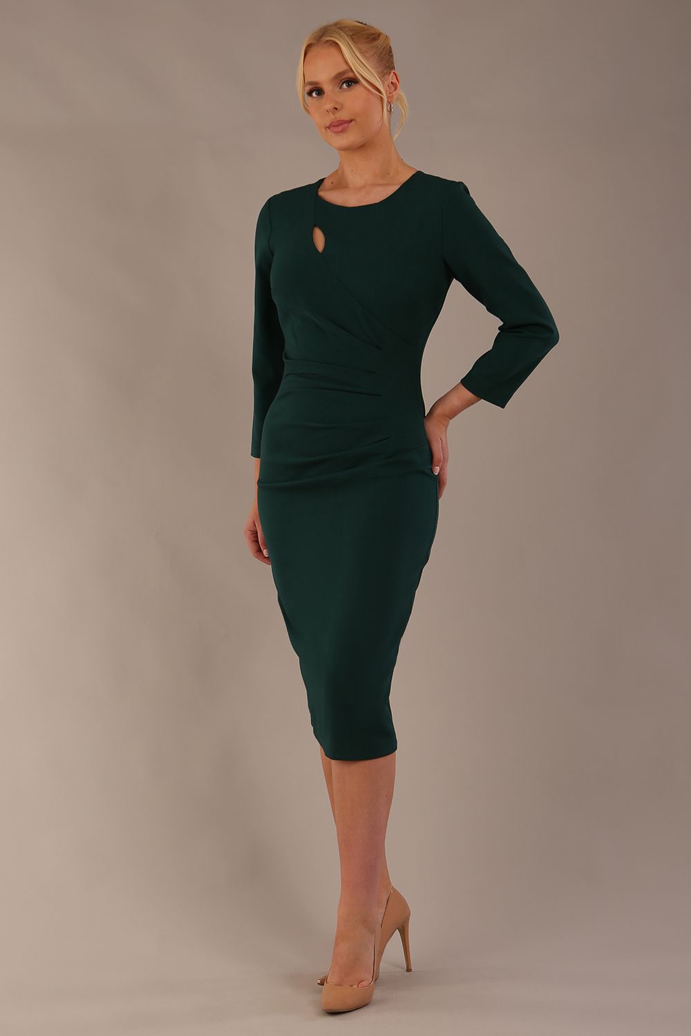 model is wearing diva catwalk miracle pencil dress with keyhole detail on a side of the front panel and gathering detail on a side or bodice panel with sleeves in forest green colour back (Forest Green)