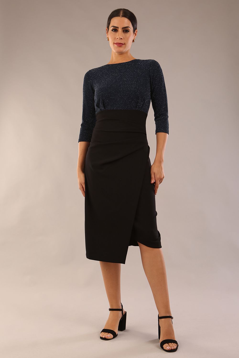 model is wearing diva catwalk contrast pencil dress with sleeve and assymetric skirt detail in black and teal sparkle front