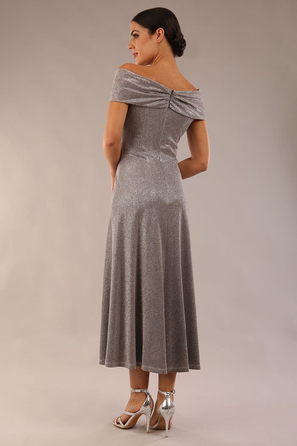 Model is wearing diva catwalk Capri A-Line Midaxi Glitter Dress off the shoulders in Iris Silver Glitter front