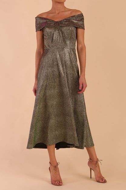 Model is wearing a diva catwalk Capri A-Line Midaxi Glitter Dress in Sherwood Glitter Gold front