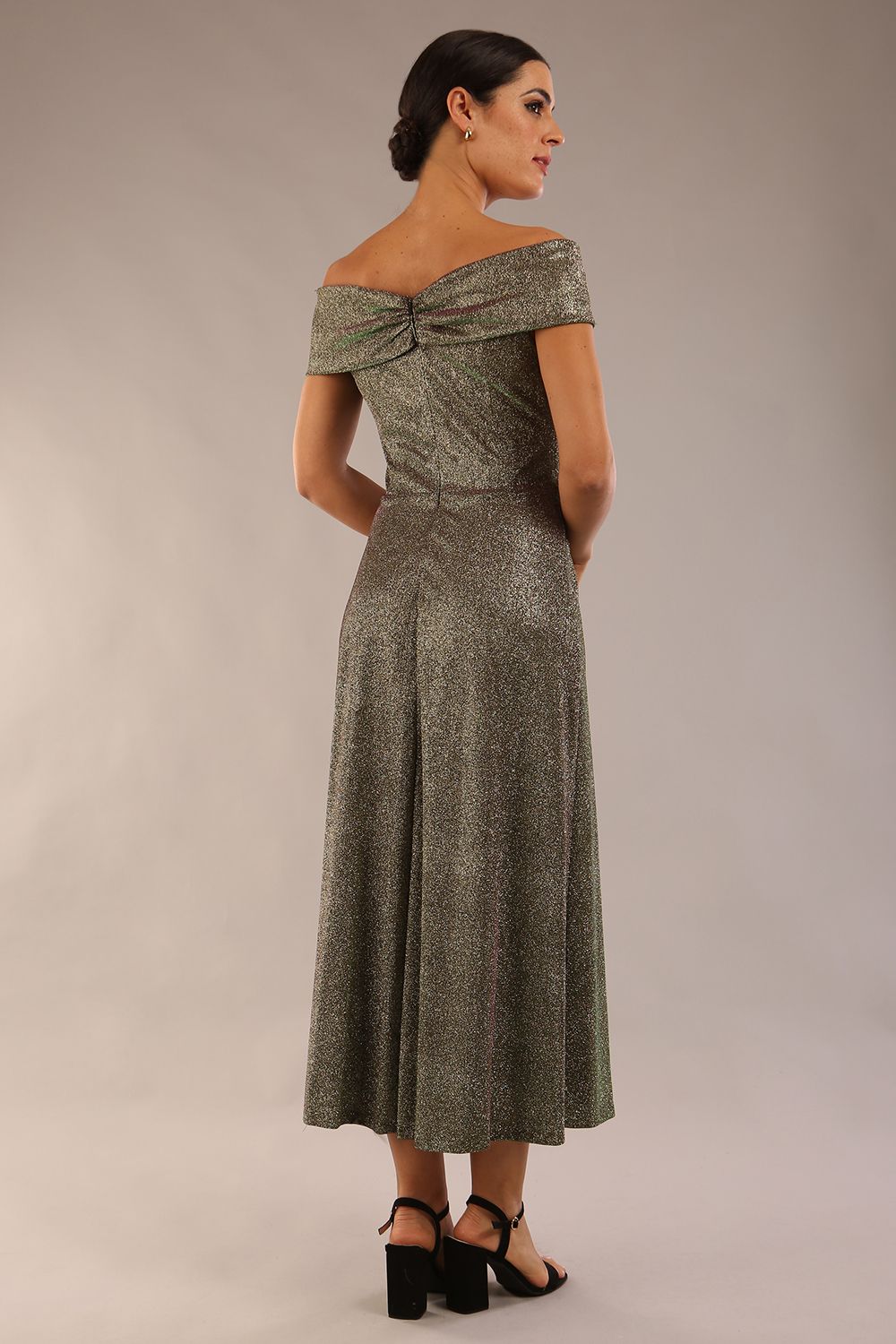 Model is wearing a diva catwalk Capri A-Line Midaxi Glitter Dress in Sherwood Glitter Gold front