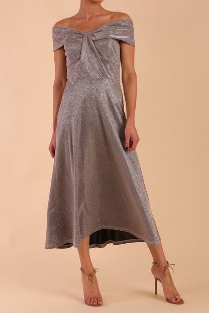 Model is wearing diva catwalk Capri A-Line Midaxi Glitter Dress off the shoulders in Iris Silver Glitter front