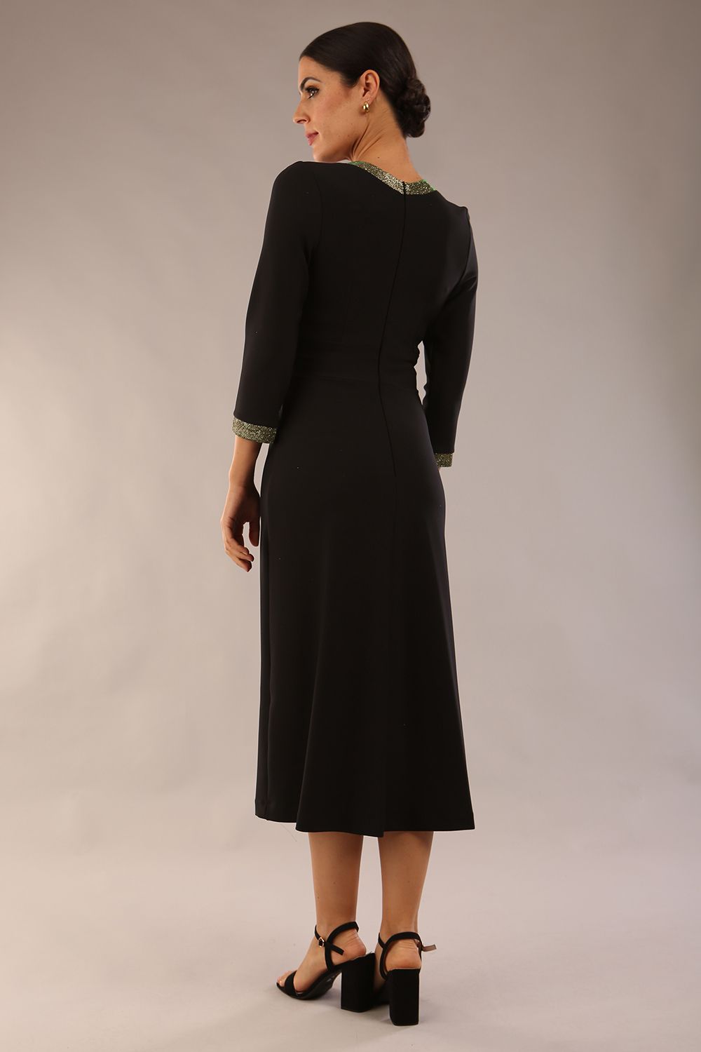 model is wearing diva catwalk carolyn swing midi dress with a band and sherwood glitter detail on sleeves and around the neckline in black colour front