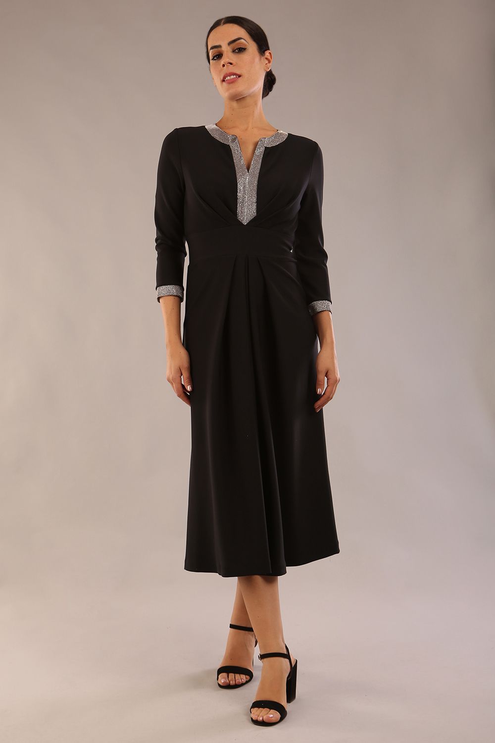 model is wearing diva catwalk carolyn swing midi dress with a band and iris silver glitter detail on sleeves and around the neckline in black colour close up