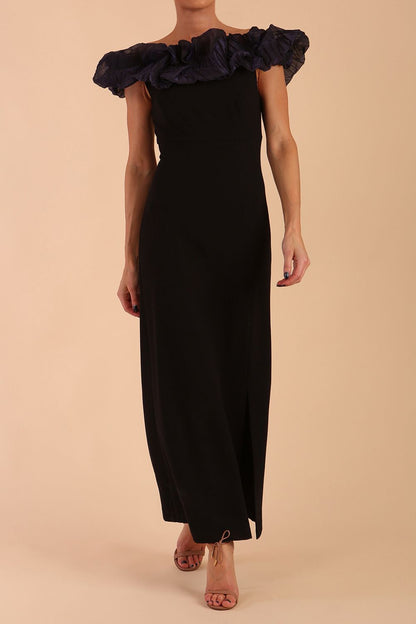 brunette model is wearing diva catwalk classique maxi black dress with off shoulder organza detail without sleeves in black and grey side