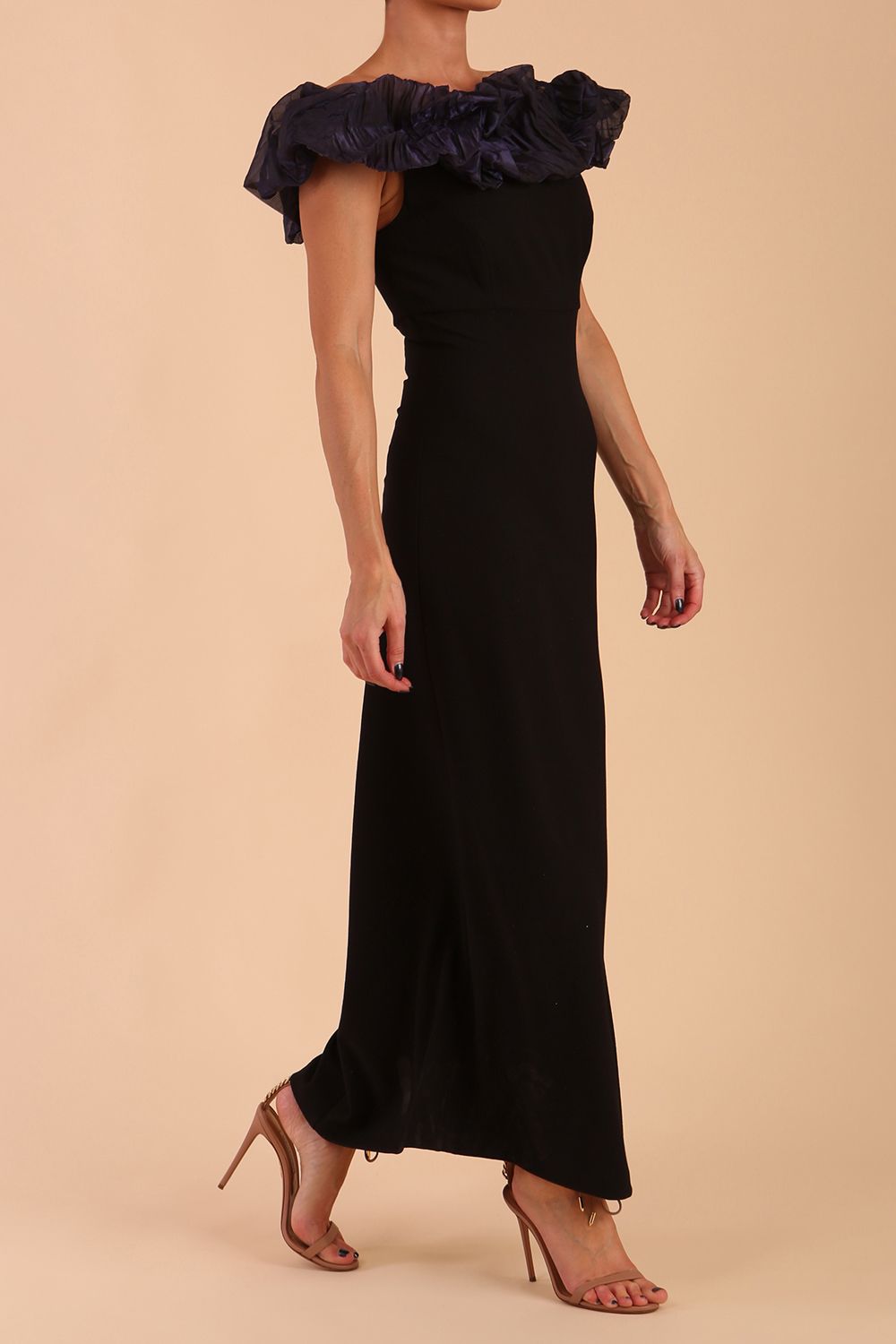 brunette model is wearing diva catwalk classique maxi black dress with off shoulder organza detail without sleeves in black and grey side