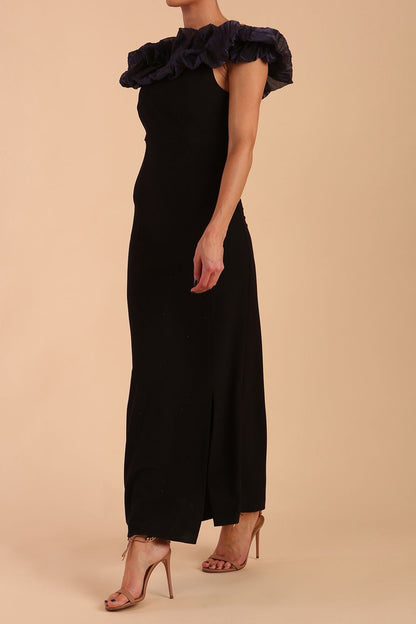 brunette model is wearing diva catwalk classique maxi black dress with off shoulder organza detail without sleeves in black and grey side