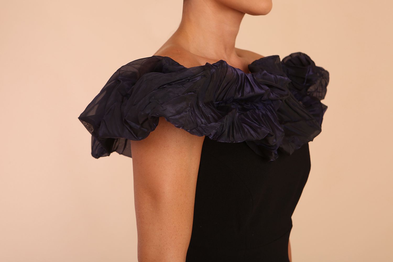 brunette model is wearing diva catwalk classique maxi black dress with off shoulder organza detail without sleeves in black and grey side