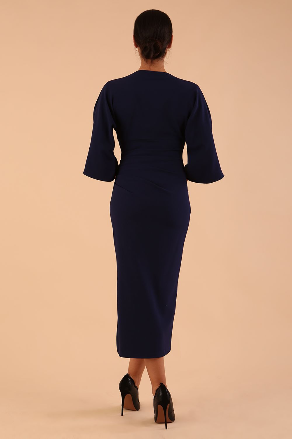 Model wearing diva catwalk Diana Cowl Neck pencil skirt dress in navy blue