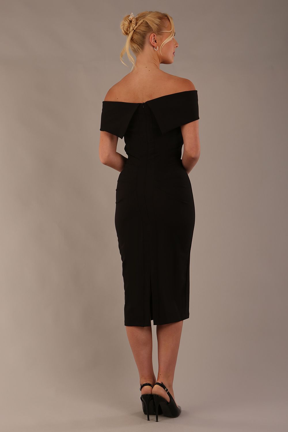 model is wearing diva catwalk amelia pencil dress with bardot neckline and ruched back in black front (Black)