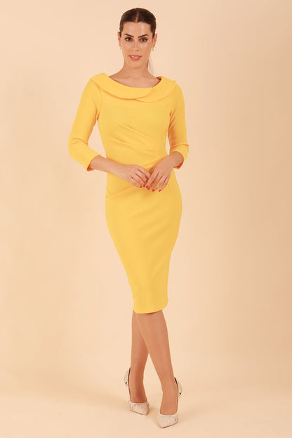 Model wearing diva catwalk Monique 3/4 Sleeve Pencil Dress with Overlapping Folded Round Neckline and 3/4 sleeves and knee length in Sunshine Yellow front