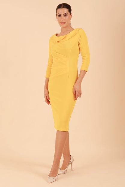 Model wearing diva catwalk Monique 3/4 Sleeve Pencil Dress with Overlapping Folded Round Neckline and 3/4 sleeves and knee length in Sunshine Yellow front