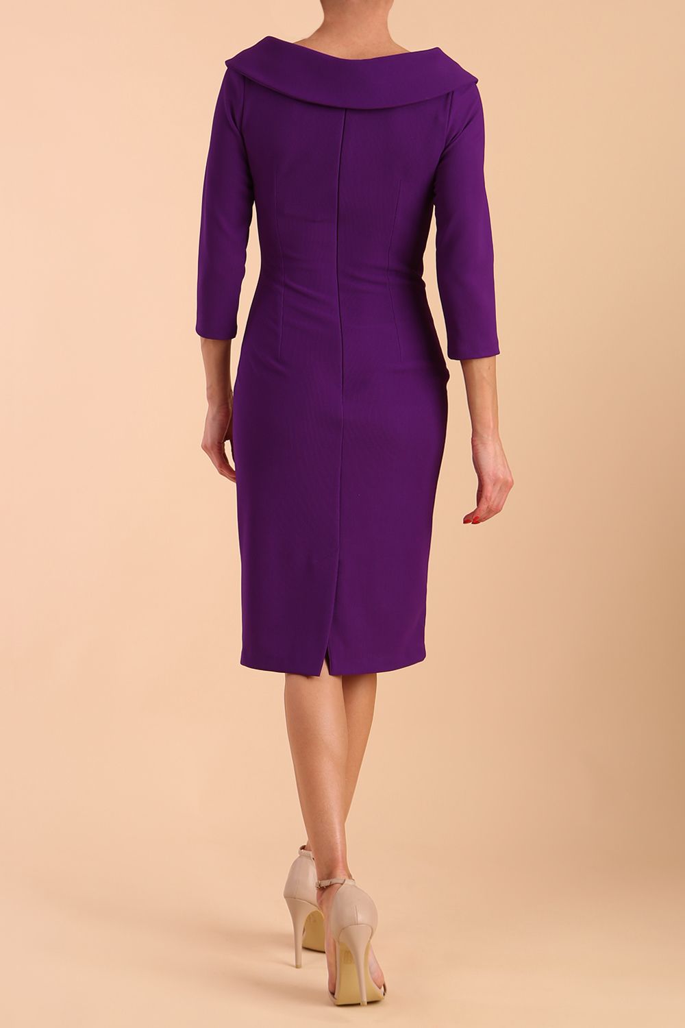 Model wearing diva catwalk Monique 3/4 Sleeve Pencil Dress with Overlapping Folded  Round Neckline and 3/4 sleeves and knee length in Passion Purple side