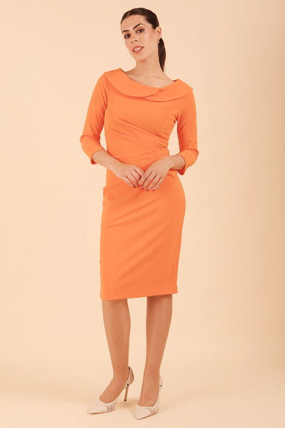 Model wearing diva catwalk Monique 3/4 Sleeve Pencil Dress with Overlapping Folded Round Neckline and 3/4 sleeves and knee length in Golden Poppy front