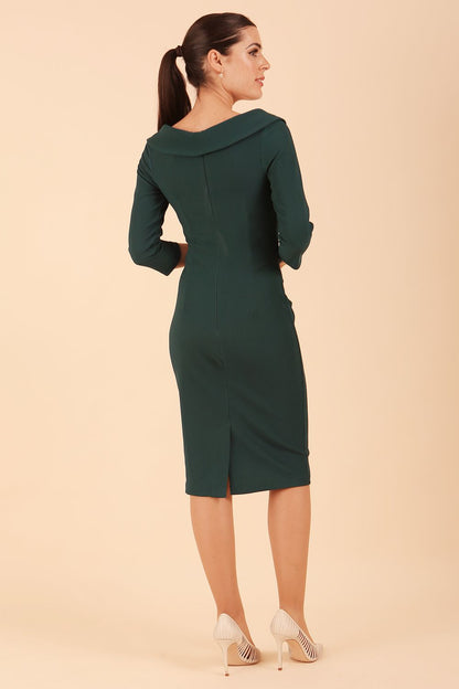 Model wearing diva catwalk Monique 3/4 Sleeve Pencil Dress with Overlapping Folded Round Neckline and 3/4 sleeves and knee length in Green Gables front