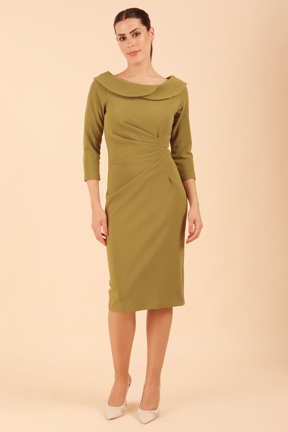 Model wearing diva catwalk Monique 3/4 Sleeve Pencil Dress with Overlapping Folded Round Neckline and 3/4 sleeves and knee length in Jasmine Green front