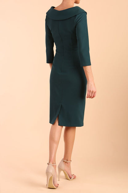Model wearing diva catwalk Monique 3/4 Sleeve Pencil Dress with Overlapping Folded Round Neckline and 3/4 sleeves and knee length in Green Gables front