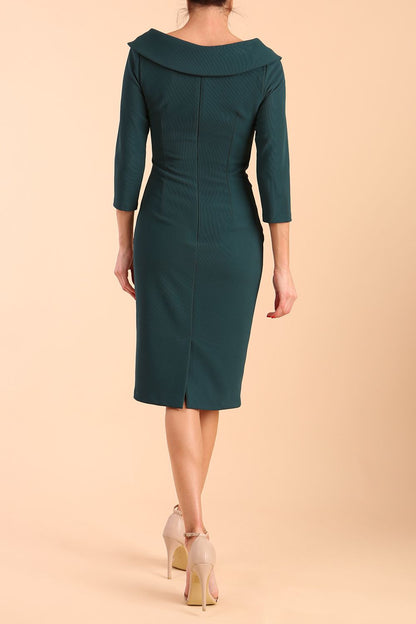 Model wearing diva catwalk Monique 3/4 Sleeve Pencil Dress with Overlapping Folded Round Neckline and 3/4 sleeves and knee length in Green Gables front