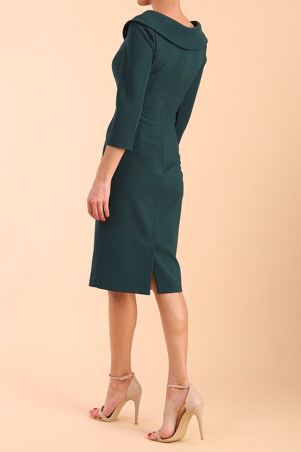 Model wearing diva catwalk Monique 3/4 Sleeve Pencil Dress with Overlapping Folded Round Neckline and 3/4 sleeves and knee length in Green Gables front