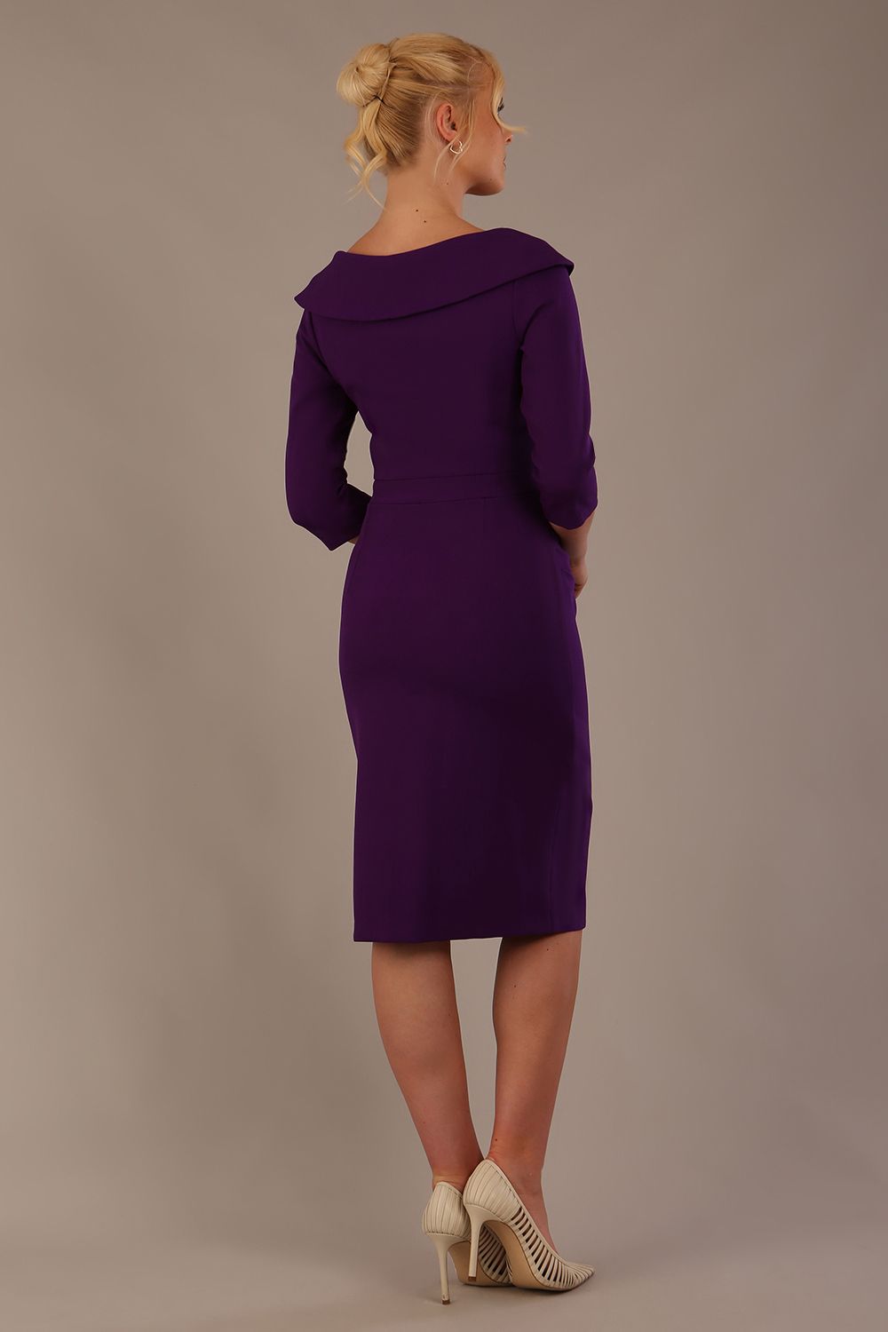 Model wearing diva catwalk Bentley 3/4 Sleeve Knee Length Pencil Dress in Deep Purple front close up