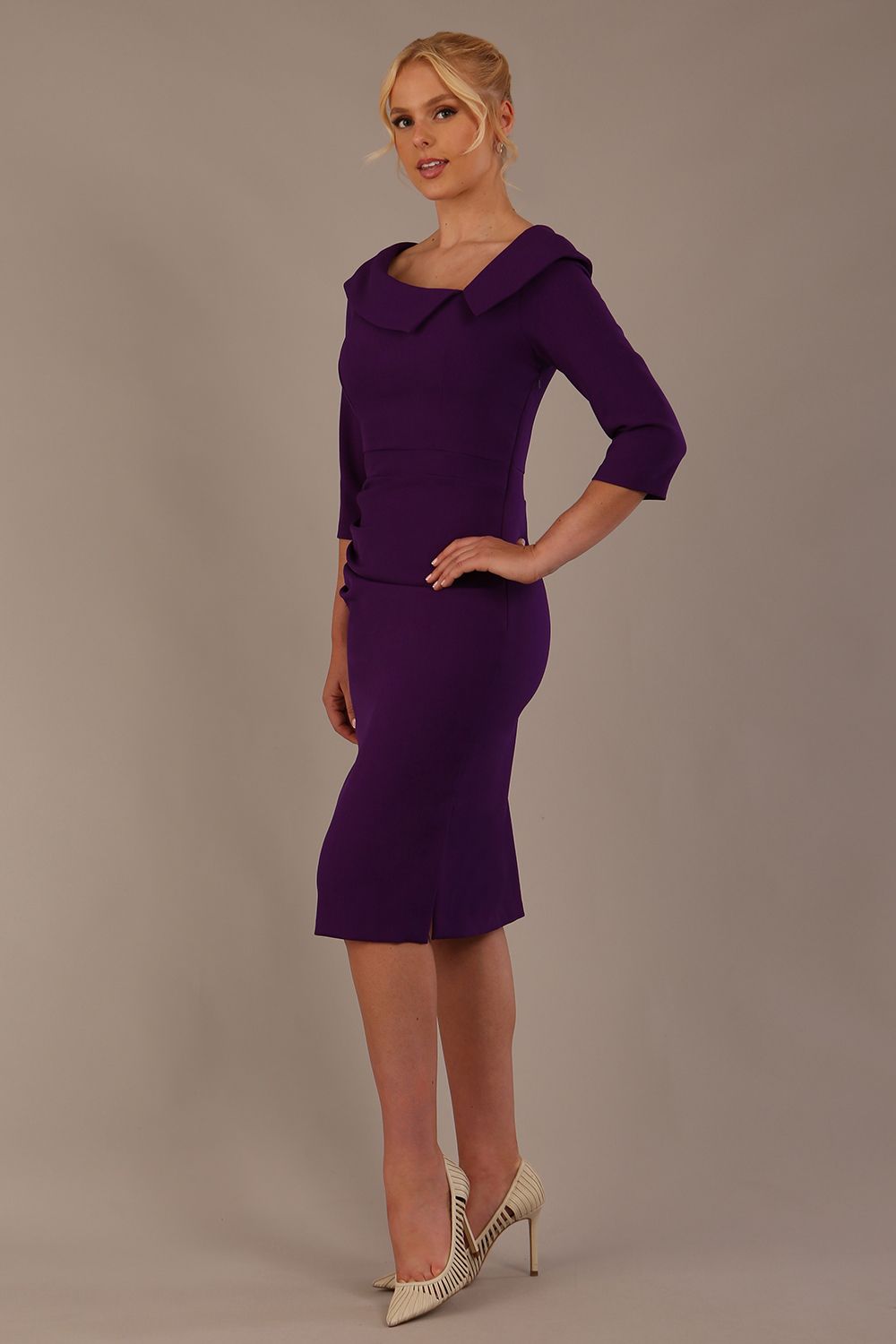 Model wearing diva catwalk Bentley 3/4 Sleeve Knee Length Pencil Dress in Deep Purple front close up