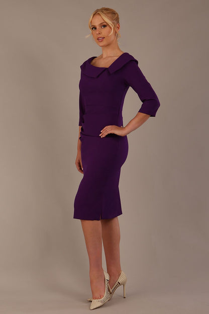 Model wearing diva catwalk Bentley 3/4 Sleeve Knee Length Pencil Dress in Deep Purple front close up