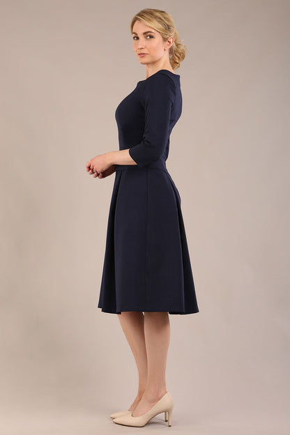 model is wearing a diva catwalk Cordelia Square Neck Pleated Midi A-line Dress with 3/4 sleeve in navy blue colour side