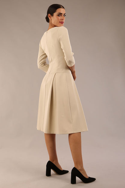 model is wearing a diva catwalk Cordelia Square Neck Pleated Midi A-line Dress with 3/4 sleeve in sandshell beige colour front