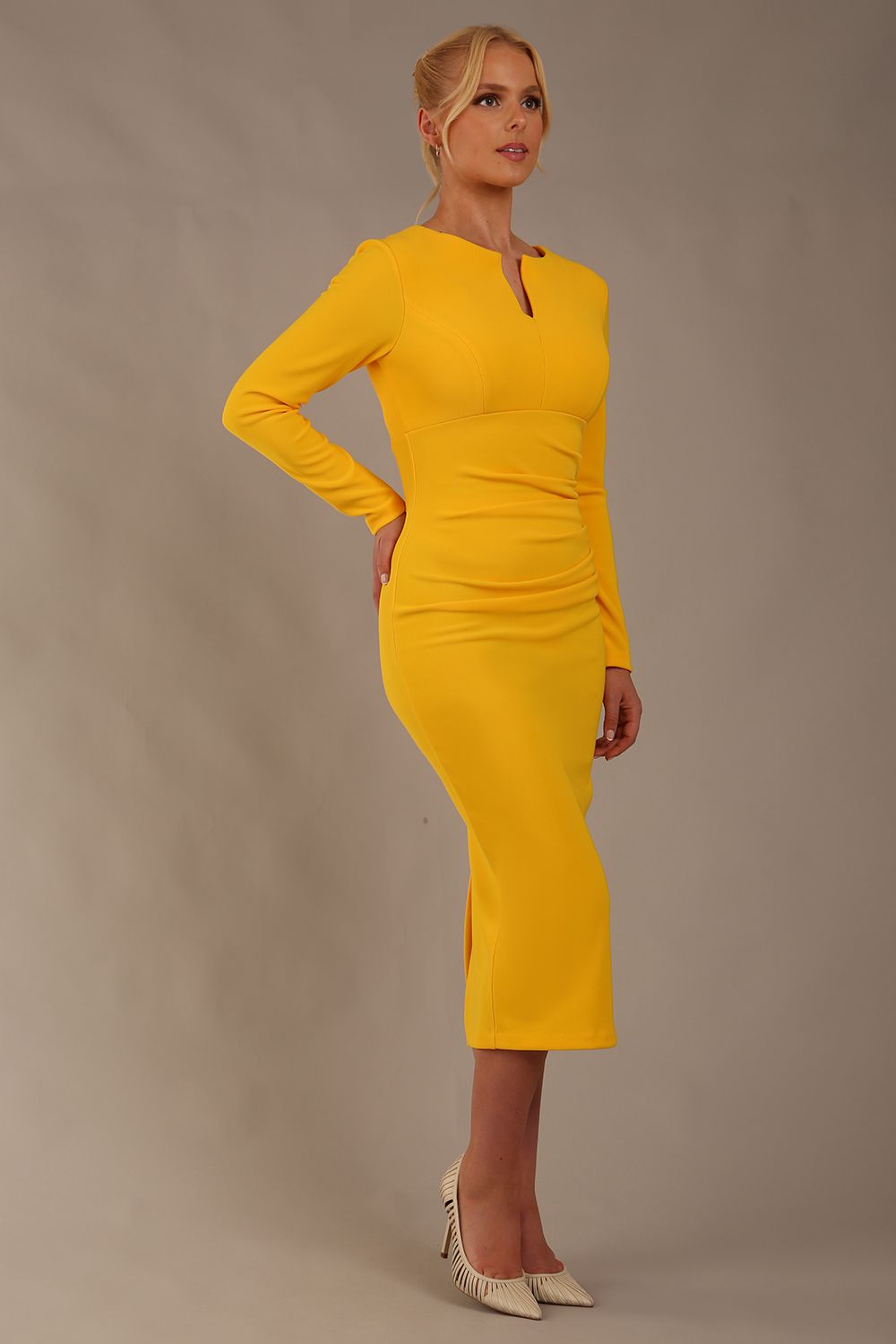 Model wearing diva catwalk Long Sleeved Lydia Midi pencil dress in Sunshine Yellow (Sunshine Yellow)