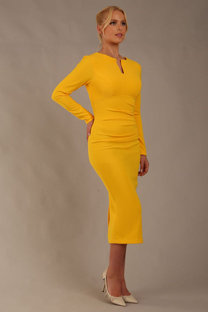 Model wearing diva catwalk Long Sleeved Lydia Midi pencil dress in Sunshine Yellow (Sunshine Yellow)
