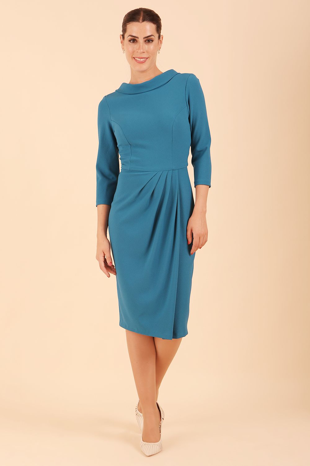 Model wearing diva catwalk Hazel pencil skirt dress with 3/4 sleeved in Tropical Teal side