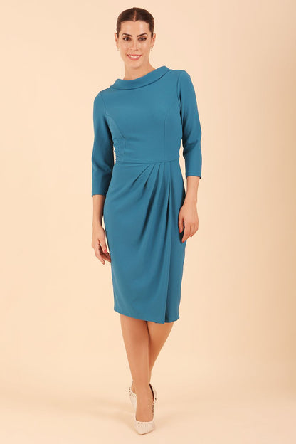 Model wearing diva catwalk Hazel pencil skirt dress with 3/4 sleeved in Tropical Teal side