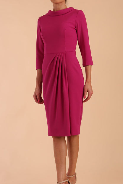 Model wearing diva catwalk Hazel pencil skirt dress with 3/4 sleeved in Magenta Haze side front