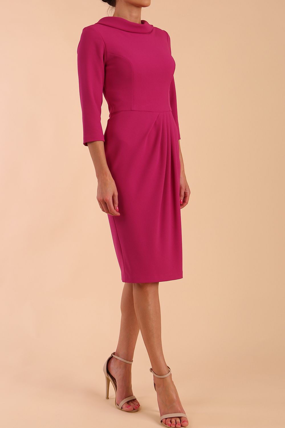 Model wearing diva catwalk Hazel pencil skirt dress with 3/4 sleeved in Magenta Haze side front