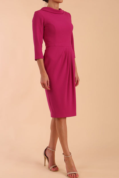 Model wearing diva catwalk Hazel pencil skirt dress with 3/4 sleeved in Magenta Haze side front